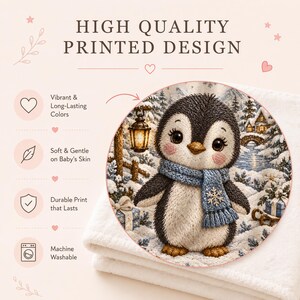 Personalized Christmas Penguin Baby Blanket with an embroidered-look print featuring an adorable baby penguin wearing a cozy blue winter scarf, surrounded by a magical snowy Christmas landscape, winter trees, glowing lantern, presents, snowflakes, stars and a charming winter village.