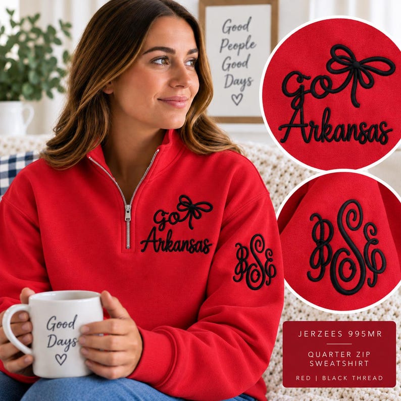 May include: A red quarter-zip sweatshirt featuring black embroidery on the chest that reads "go Arkansas" with a bow icon. The left sleeve displays a black embroidered monogram with the letters "BSE" in a script font. The fabric is red.