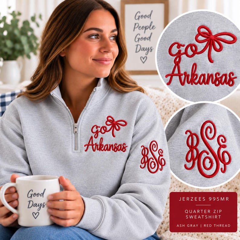 May include: An ash gray quarter-zip sweatshirt featuring red embroidery on the chest that reads "go Arkansas" with a bow icon. The left sleeve displays a red embroidered monogram with the letters "BSE" in a decorative script font.