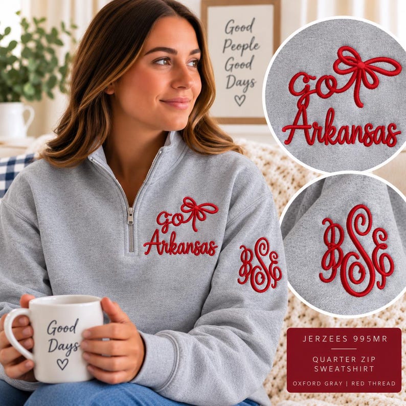 May include: A heather gray quarter-zip sweatshirt featuring red embroidery on the chest that reads "go Arkansas" with a bow icon. The left sleeve displays a red embroidered monogram with the letters "BSE" in a decorative script font.