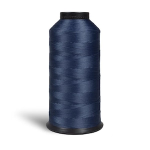 May include: A spool of dark blue thread.