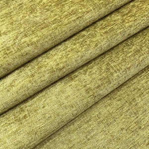 May include: Close-up of a textured fabric in a muted green colour. The fabric has a subtle sheen and a slightly rough texture.