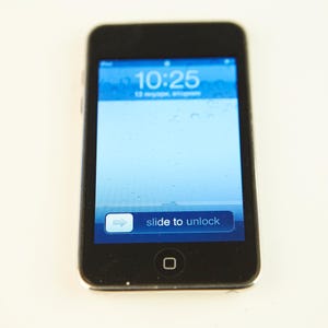 May include: A black iPhone with a blue screen displaying the time 10:25 and the text "slide to unlock".