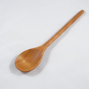 Hand carved wooden spoon for cooking, cherry wood
