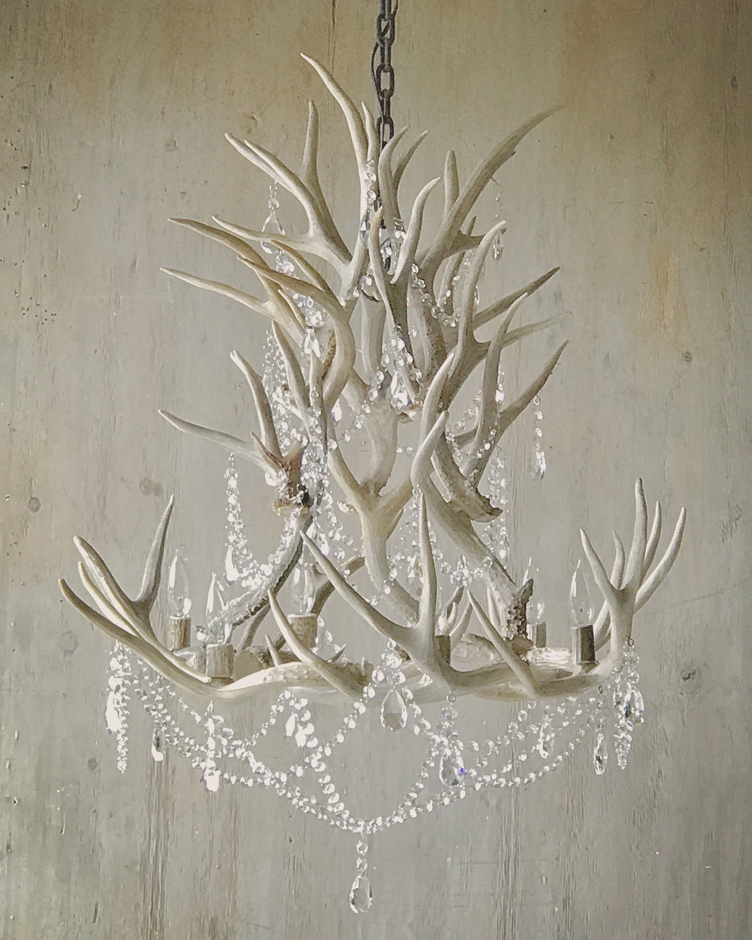 Antler Chandelier, hand crafted from real antlers adorned with authentic leaded crystals.