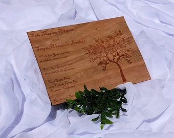 May include: A wooden wedding invitation with a laser-engraved tree design. The invitation reads "Sole Marine Alkazar and Sergio Alexander Benitez. We would like you to join them to celebrate their marriage.  Sat., July 7, 2018 at 5 o'clock in the afternoon. Buen Gusto Farm, 3905 Cachula Large Rd, Ventura, California. Reception to follow."
