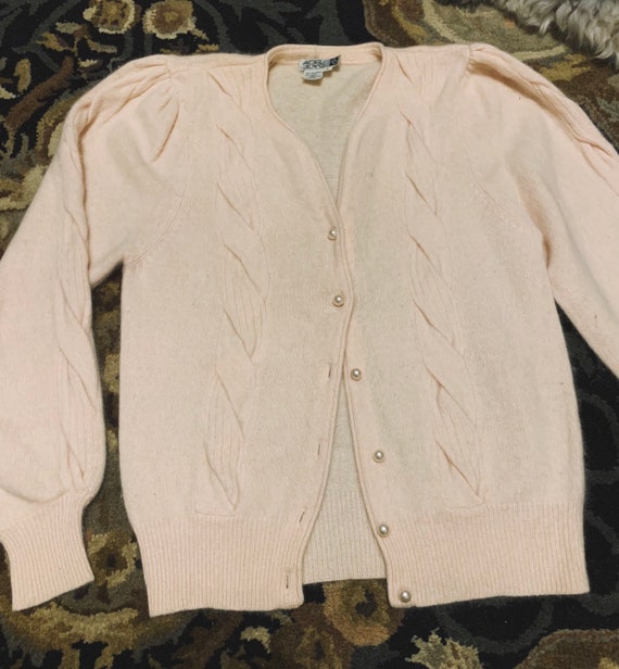 pink cardigan with pearl buttons