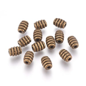 50 Antique Bronze Tone Barrel Spacer Beads 7x5.5mm  (A366J)