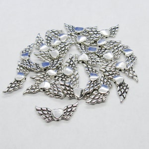 25 Antique Silver Tone 22x9mm Alloy Angel Wing w/Heart Spacer Beads (A203v)