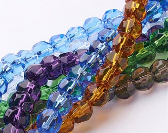 May include: A strand of faceted glass beads in various colors, including purple, blue, green, and amber. The beads are arranged in a staggered pattern, creating a visually appealing display.