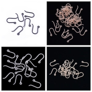 May include: A set of 20 black and white earring hooks. The hooks are made of metal and have a simple design. They are perfect for making your own earrings.