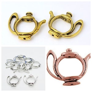 May include: A set of teapot charms in gold, silver, and rose gold finishes. The charms are made of metal and have a detailed design. They are perfect for adding a touch of whimsy to jewelry or crafts.