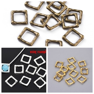May include: A group of small, square-shaped metal beads with a hammered texture. The beads are available in three colors: antique brass, silver, and gold.  The beads are shown in a close-up view, with some of the beads arranged in a pattern.  The beads are ideal for jewelry making, crafting, and other DIY projects.