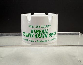 Cenicero antiguo con tapa de lata de la cooperativa de granos Kimball County. Publicidad.