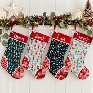 May include: Four personalised Christmas stockings with red cuffs and white bows. Each stocking features a unique holiday pattern, including stockings, animals, festive icons, and snowmen, with the names Dylan, Sarah, Leon, and Jarrah embroidered.