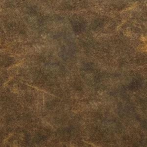 May include: Close-up of a textured, brown leather surface. The leather has a mottled appearance with variations in color, ranging from dark brown to lighter tan hues. The surface shows subtle imperfections and a natural grain.