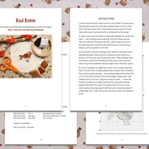 May include: A counted cross stitch pattern titled "Red Robin" with instructions and materials. The design features a red robin on a white background, with orange scissors and embroidery floss. The pattern is on a white paper.
