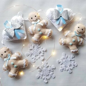 Gingerbread man and hearts Christmas garland in cream, white and blue