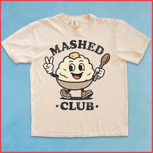 Camiseta gráfica del Club de Puré de Papas: divertida camiseta retro con la mascota de la papa y colores cómodos