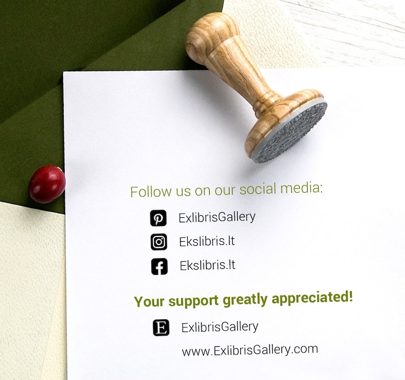 May include: A wooden stamp with a gray imprint surface rests on a white paper. The text "Follow us on our social media:" and social media icons are visible. The text "Your support greatly appreciated!" is also present.