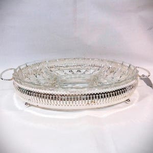 Glass server, with silver chrome basket, sectional serving dish, server on a stainless silver carrier. Cut glass serving dish.