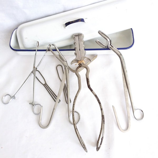 Medical instruments, vintage surgical tools, and tin steriliser.  Vintage surgeons tools mid century instruments.