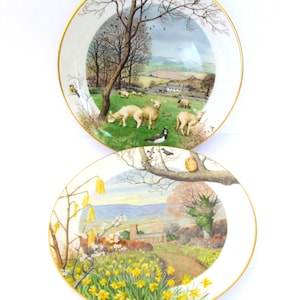 Royal Worcester, collectors plates by Peter Barrett, 2 china plates, January Lambing Season and A Country Church in March
