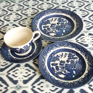Blue Willow pattern 4 matching blue willow, Churchill,  tea cup, saucer, tea plate and salad plate. Blue and white china tea set.