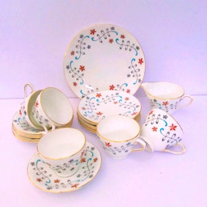 Sutherland Delphine bone china 20 piece vintage tea service, cups, saucers, tea plates, cake plate, and creamer.