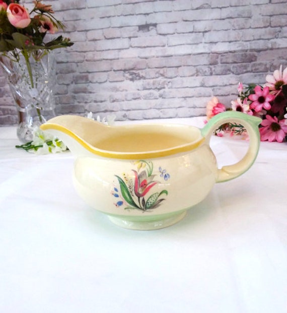 A Large Wedgwood Stoneware Nautilus Form Sauce Boat and Stand A Large Wedgwood Stoneware Nautilus Form Sauce Boat and Stand