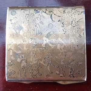 Stratton compact, 1930s square powder compact, mirrored compact with a sports theme, tennis, skating, football..