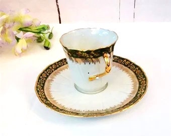 Limoges La Reine Porcelain Cup and Saucer: Green & Gold Twist Handle