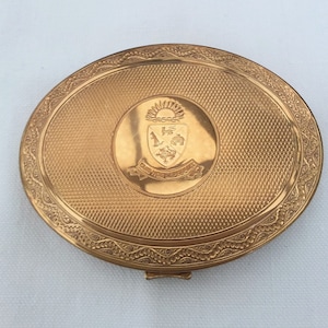 Kigu powder compact, P & O Shield, Quis nos Separabit, gold tone oval, mirrored powder compact.