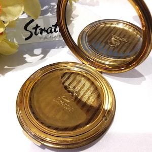 Stratton powder compact, 1950s gold tone, monogram lid with &#39;Enid&#39; inscribed, for use with solid powder.