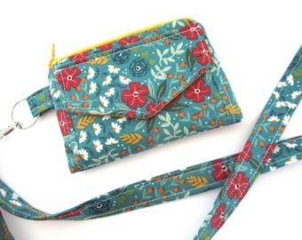 ID-portemonnee van stof met bloemenprint in turquoise, sleutelhangertje met rits en optie voor een draagkoord.