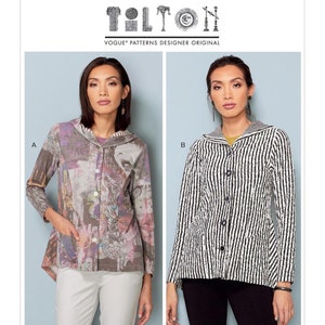 May include: Two women model a long-sleeved button-up shirt with a hood. The shirt on the left is a multi-colored print with a grey background. The shirt on the right is black and white striped. The pattern is Vogue Patterns Designer Original V9244.