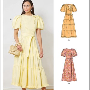 May include: A woman wearing a pale yellow midi dress with short, puffed sleeves, a belted waist, and a tiered skirt. The dress is paired with a straw handbag and beige sandals. The image also shows two dress illustrations.