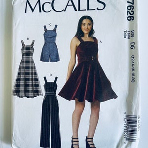May include: McCall's sewing pattern M7626 featuring four different garment designs. The pattern includes a dress, romper, and jumpsuit. The size is D5 (12-14-16-18-20). The cover shows a woman wearing a burgundy dress.