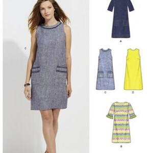 May include: A woman models a sleeveless, knee-length blue dress with dark trim and pockets. The image also shows illustrations of other dress styles, including a yellow dress and a striped sleeve dress. The New Look pattern number is 6500.