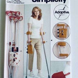 May include: Simplicity Adaptive sewing pattern R11700 for making crutch covers and shoe covers. The pattern includes instructions for making a variety of styles, including a floral print crutch cover, a solid yellow crutch cover, and a red shoe cover.