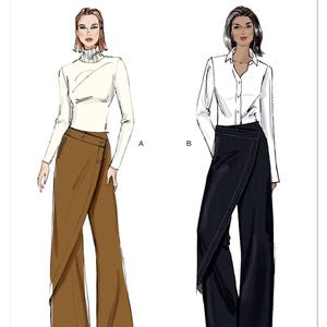 May include: Vogue Patterns V2138. Illustration of two women wearing wrap-style pants. One model wears brown pants with a white turtleneck top. The other model wears navy pinstripe pants with a white button-down shirt. The Vogue Patterns logo is at the top.
