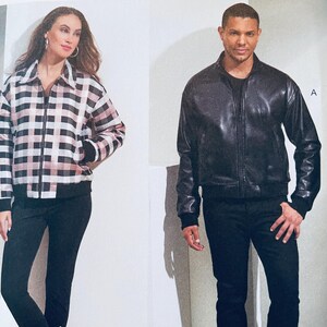 May include: Two fashion pattern designs for jackets. The design on the left is a plaid jacket with a zipper closure. The design on the right is a black leather jacket with a zipper closure. The text "V1877" and "VOGUE PATTERNS" is visible in the image.
