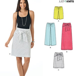 May include: A sewing pattern for a skirt with four different styles. The pattern is called "easy JUST4KNITS" and has the number 6348 on it. The skirt styles include a yellow skirt with a front slit, a light blue skirt with a front slit, a pink skirt with a bow, and a striped skirt with a bow.