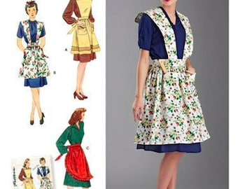 以下が含まれることがあります： 1940 年代スタイルのエプロン用のヴィンテージソーイングパターン。このパターンには、すべて花柄の3種類のエプロンスタイルが含まれています。パターンはSimplicity製で、番号は8669です。