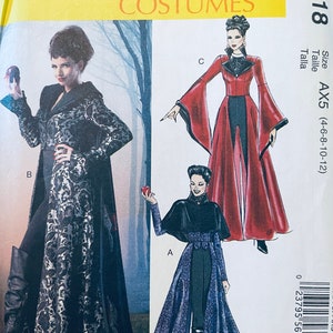 May include: McCall's Costumes pattern featuring three different costume designs. The costumes include long flowing gowns and capes in black, red, and purple. The pattern size is AX5 (4-6-8-10-12).