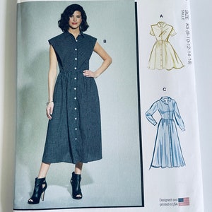 May include: McCall's sewing pattern for a dress with three different views. The pattern is for sizes 8-10-12-14-16. The dress is a button-down style with a collar and short sleeves. The pattern is designed and printed in the USA.