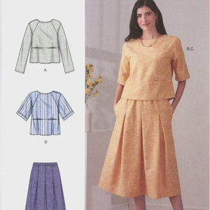 May include: Simplicity sewing pattern S9264 for sizes XXS-XL. The pattern includes a top with a round neckline and a skirt with pleats. Illustrations show variations A, B, and C, while a photograph displays a yellow top and matching skirt.