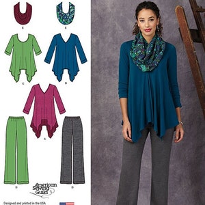 May include: Simplicity sewing pattern 1323 featuring tops and pants. The image shows a woman wearing a teal top and gray pants. The pattern includes various top styles in green, teal, and burgundy, and pants in green and gray.
