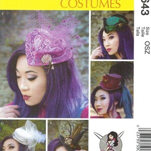 May include: McCall's Costumes pattern M7643 featuring various costume hat designs. The hats include a purple paisley design with netting, a green and black hat, a burgundy top hat, a white hat with netting, and a brown hat with feathers.