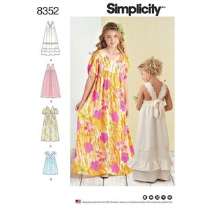 May include: Simplicity sewing pattern featuring four different girls' dress designs. The dresses include a white eyelet dress, a pink dress, a floral dress, and a blue dress. The cover shows two girls wearing dresses.